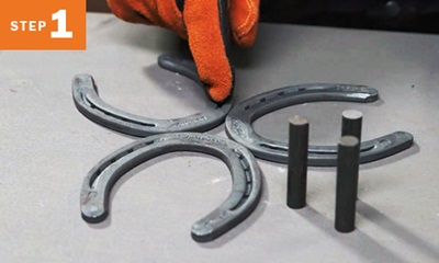 Three horseshoes placed together with three stocks next to them
