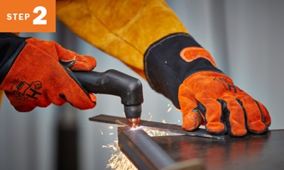 close up of cutting metal with a plasma cutting torch