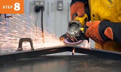 close up of welder grinding metal